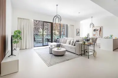a living room with a couch and a table at Frank Porter - Grande Signature in Dubai