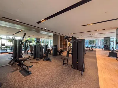 a gym with a lot of treadmills and exercise equipment at Frank Porter - Grande Signature in Dubai