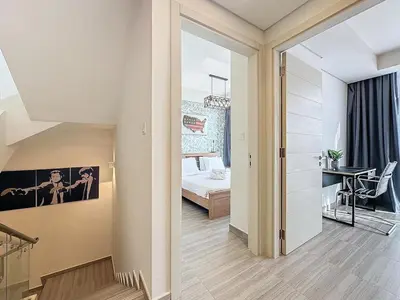 a bedroom with a bed and a desk in a room at 3 Bed - Aquilegia, Damac 2 in Dubai