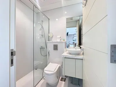 a white bathroom with a toilet and a sink at 3 Bed - Aquilegia, Damac 2 in Dubai