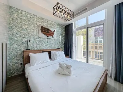 a bedroom with a bed with a bow on it at 3 Bed - Aquilegia, Damac 2 in Dubai
