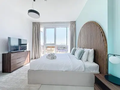 a bedroom with a large bed and a large window at One Residence - Retreat in Dubai