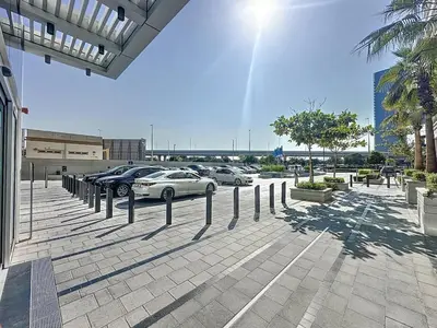 a parking lot with cars parked in a parking lot at One Residence - Retreat in Dubai