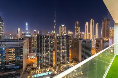 a view of a city skyline at night at Stunning Burj View - Cozy 2BR - 5 min Dubai Mall in Dubai