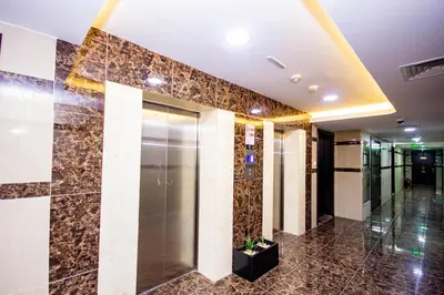 a lobby with a elevator in a building at Newly furnished brand new 1BHK in Al Warsan in Dubai