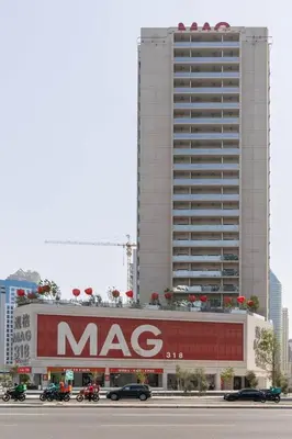 a large building with a mac sign in front of it at GuestReady - Business Bay delight in Dubai