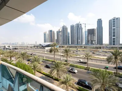 a view of a city with palm trees and buildings at Amiqa Homes Dubai Marina in Dubai