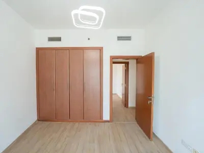 an empty room with a closet and a door at Amiqa Homes Dubai Marina in Dubai