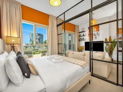 a bedroom with a large bed and a large window at Collective Chic 1BR 15mins to Downtown Dubai Mall Beaches in Dubai