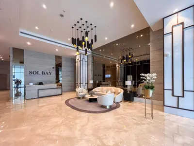 a lobby with a solaw law at Cozy Studio Pool & Gym Near Burj Khalifa & Racecourse views in Dubai