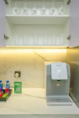 a laptop sitting on top of a counter at New Family-Friendly 2BR with Gym and Pool and Sauna in Dubai