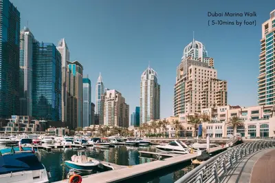 a view of a city with boats in a marina at Fabulous 1BR in Dubai Marina near Beach With Sea Views in Dubai