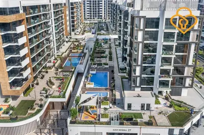 an aerial view of an apartment complex with buildings at Keysplease Studio Azizi Riviera Near Downtown, Meydan One in Dubai