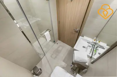 a bathroom with a shower and a sink and a mirror at Keysplease Studio Azizi Riviera Near Downtown, Meydan One in Dubai