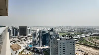 an aerial view of a city with tall buildings at High Floor - Bright Elite Studio in Business Bay in Dubai