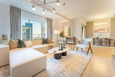 a living room with a couch and a table at Close to Major Landmarks 3BR and Assistant Room with Marina Views, Rimal 5, JBR by Deluxe Holiday Homes in Dubai