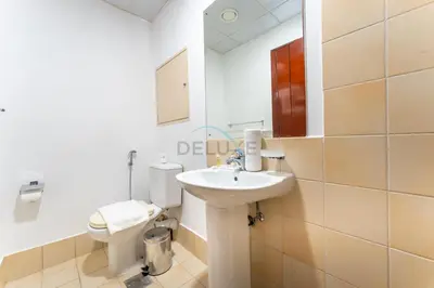 a bathroom with a sink and a toilet at Close to Major Landmarks 3BR and Assistant Room with Marina Views, Rimal 5, JBR by Deluxe Holiday Homes in Dubai