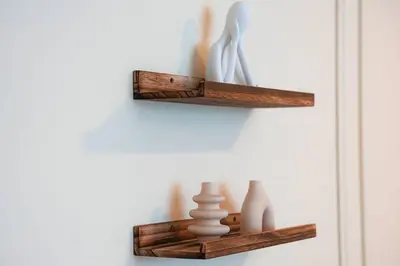 a room with two wooden shelves on a wall at Luxe JLT 1BR Apt Gym Pool & Stunning Views in Dubai