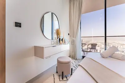 a white bedroom with a mirror and a bed at City Views 1BR Near Community Park with Private Balcony, Binghatti House, Jumeirah Village Circle by Deluxe Holiday Homes in Dubai