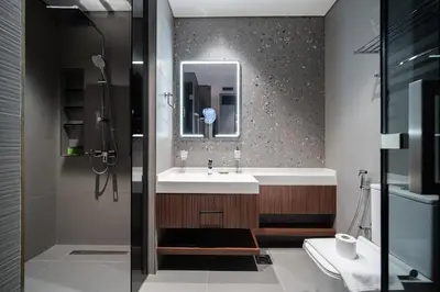a bathroom with a sink and a mirror at SettlerHomes - Elegant JLT Lakefront Near Metro in Dubai