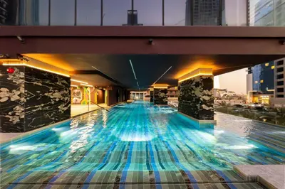 a swimming pool on the top of a building at SettlerHomes - Elegant JLT Lakefront Near Metro in Dubai