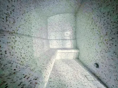 a corner of a room with a brick wall at Brand New Business Bay 1 Bed with Burj Khalifa and Canal Views in Dubai