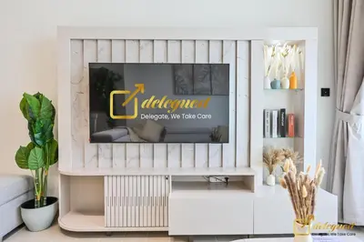 a living room with a tv on a wall at Marvelous 1BR in Binghati Amber by deleguest in Dubai