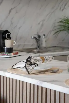 a plate on top of a table with a sink at Frank Porter - Rokane G22 in Dubai