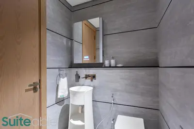 a bathroom with a sink and a mirror at Sophisticated Studio in The Autograph in Dubai