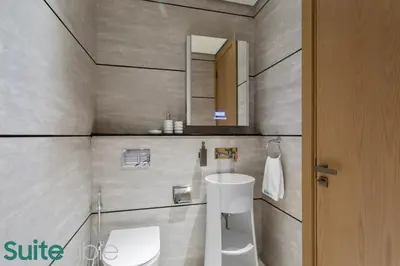 a bathroom with a sink and a mirror at Chic Studio with Pool Access in The Autograph in Dubai