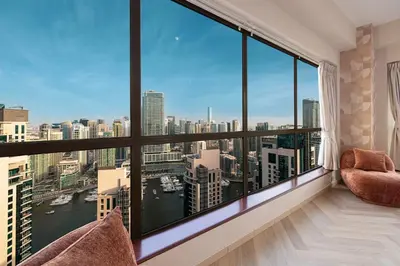 a room with a large window with a view of the city at KYMA 2BDR JBR - Luxury Apartment with Full Panoramic Dubai Marina view in Dubai
