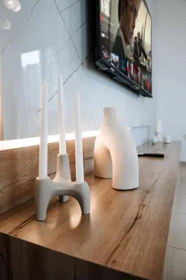 two white sculptures sitting on top of a wooden table at Best location in Downtown Dubai in Dubai