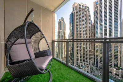 a swing on a balcony with a view of a city at Best location in Downtown Dubai in Dubai