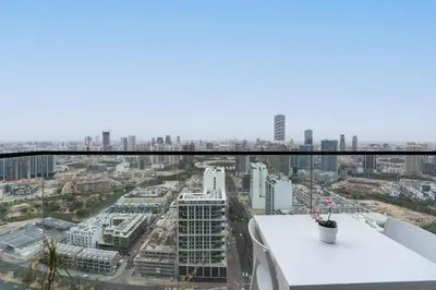 a view of a city from the top of a building at Cozy Studio with Sleek Design in JVC in Dubai