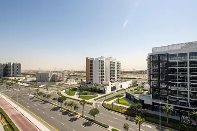 an aerial view of a city with buildings and a highway at Frank Porter - Azizi Riviera 28 in Dubai