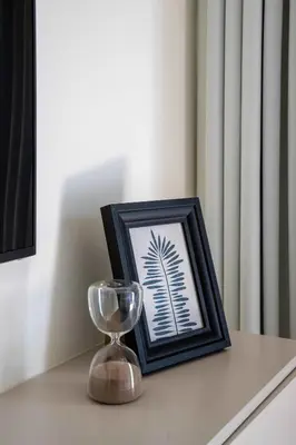 a picture of a palm tree in a frame on a table at Frank Porter - Azizi Riviera 28 in Dubai