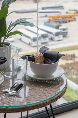 a table with a bowl on a glass table at Frank Porter - Azizi Riviera 1 in Dubai