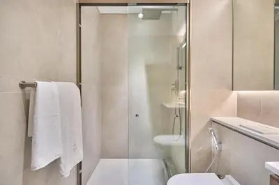 a bathroom with a shower and a toilet and a sink at STAY BY LATINEM Luxury 1BR Holiday Home CVG 710 Near Burj Khalifa in Dubai