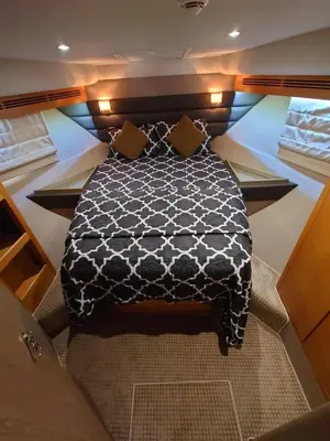 a bedroom with a black and white bed in a boat at Luna Rosa in Dubai