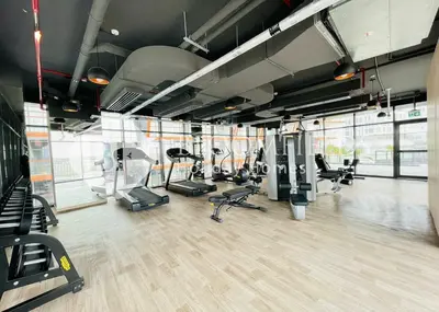 a gym with treadmills and elliptical machines at Bloomfields 1Br The Avenue Suite Bingahtti in Dubai