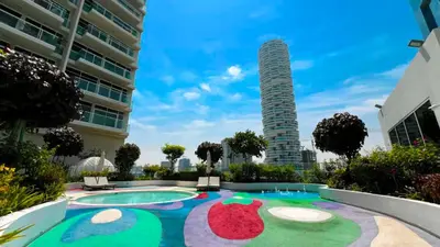 a view of a pool in the middle of a building at Wonderful Stay At Zaya Hameni - Best Amenities - Unique in JVC - Brand New Luxury Apartments in Dubai