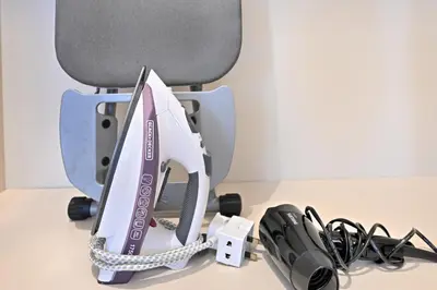 a office chair with a fax machine and a controller at Stunning 1 Bdr Luxury with Burj Khalifa View in Dubai