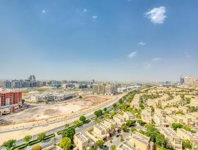 an aerial view of a city with buildings at Posh Studio Apartments in Dubai
