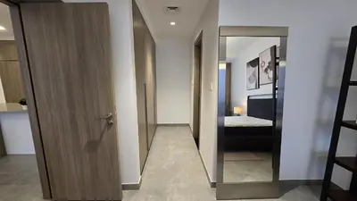 a hallway with a door leading to a bedroom at Stella Maris Marine view in Dubai