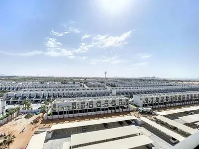 an aerial view of a large parking lot at Mag Eye - Cozy Studio in Meydan in Dubai
