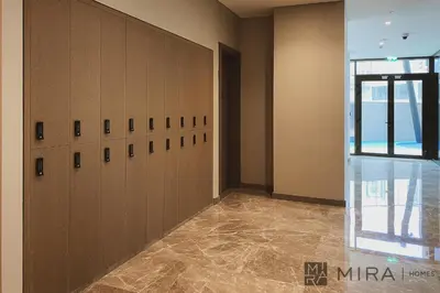 a large room with lockers in a building at Mira Holiday Homes - newly and cosy studio with balcony in Business Bay in Dubai