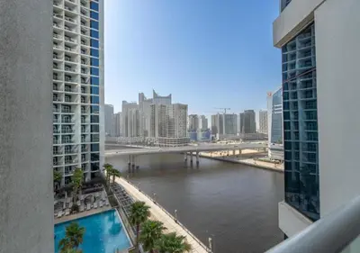 a view of a river in a city with buildings at Bespoke Holiday Homes - Luxurious Studio in Damac Maison Prive in Dubai