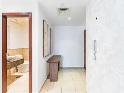a bathroom with a sink and a toilet and a mirror at The Cozy Cove 1BR at Rimal 4,JBR in Dubai