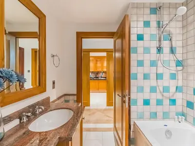 a bathroom with a sink and a shower at Cozy 1BR- Yansoon 4- Heart of Downtown Dubai in Dubai