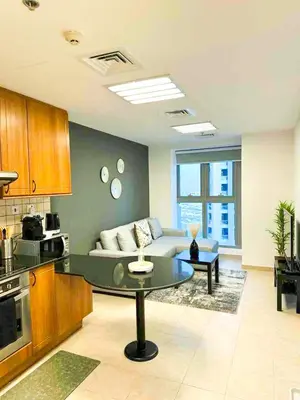 a living room with a couch and a table at Luxury 2-bedroom in Dubai Marina with Sea View in Dubai